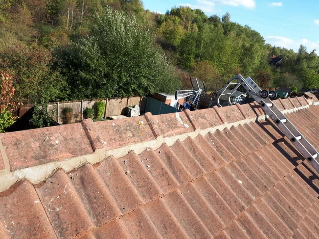 Ridge tiles re-bedded and pointed